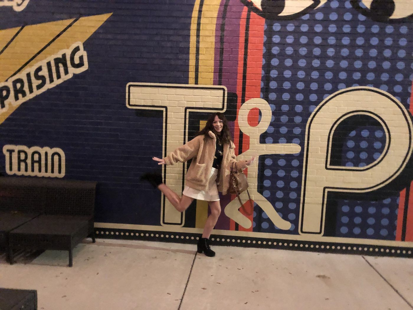 Colorful retro Tipp City mural on a downtown brick wall